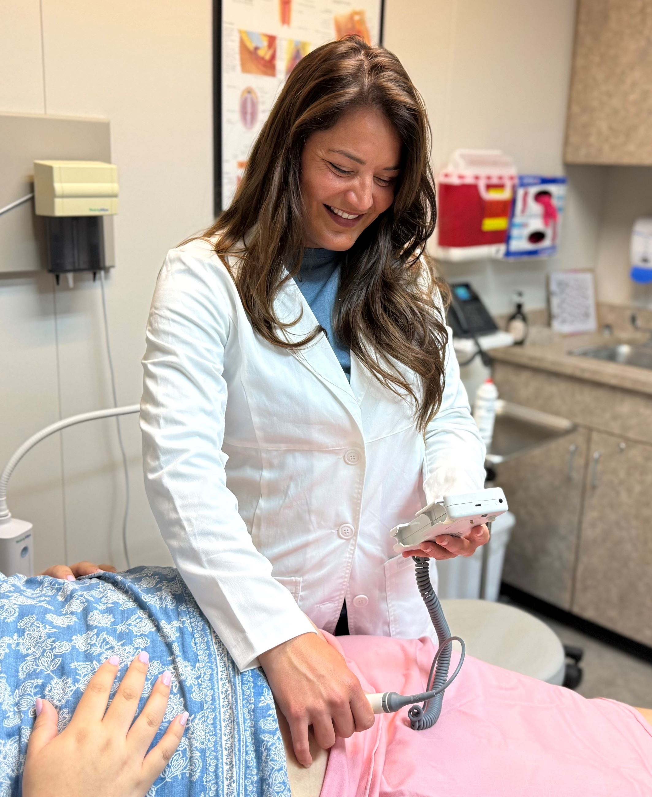 Chelsie Mattox listens for a heartbeat. 